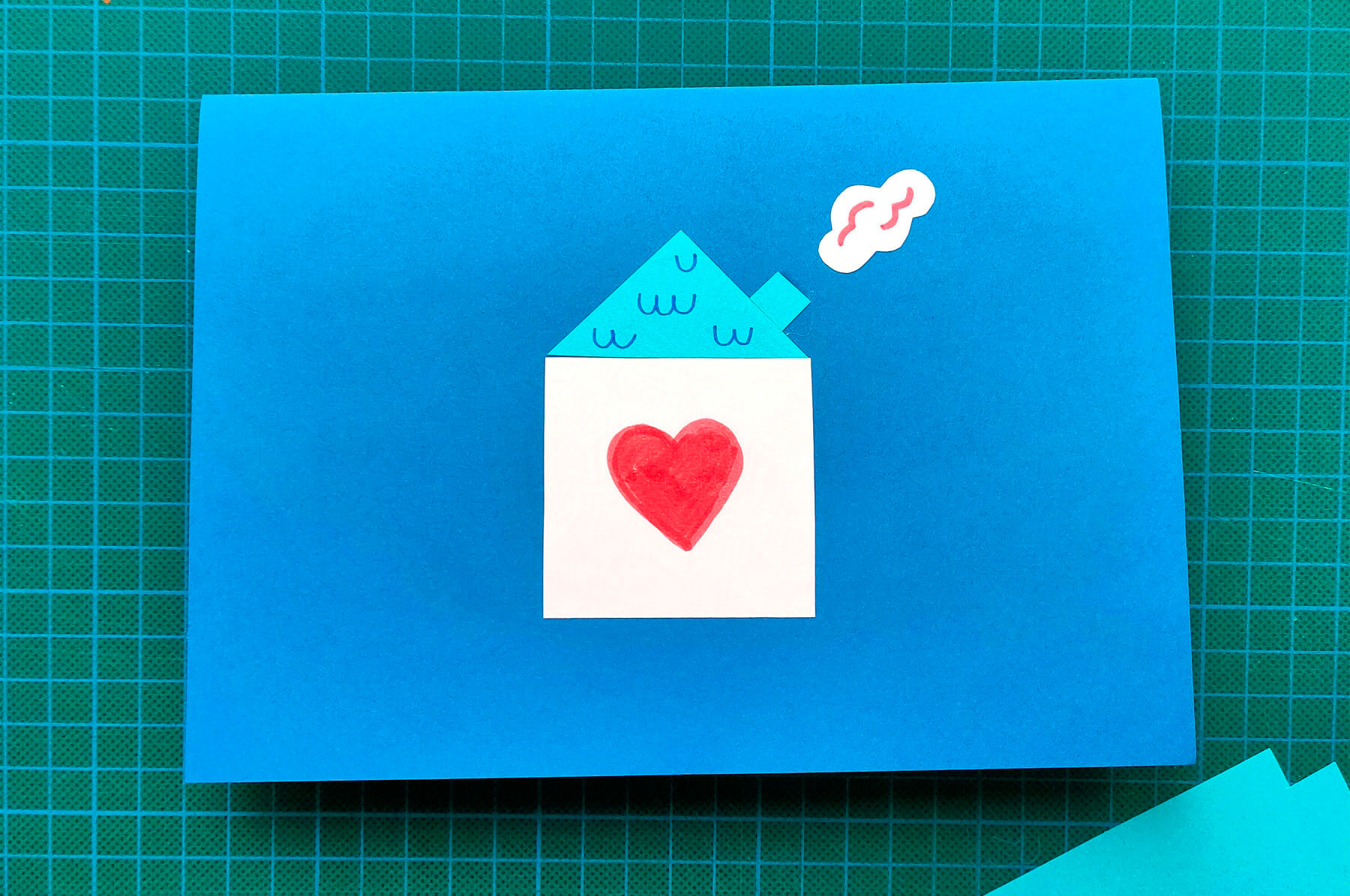 atelier créatif de carte pop-up pour les enfants avec du papier découpé et des feutres en lien avec le roman jeunesse Un toit pour tous